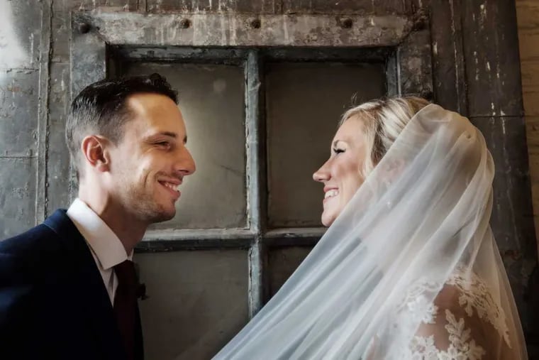 In March, Daniel and Jenna Garrison share a smile inside the Skybox Event Center in Fishtown.