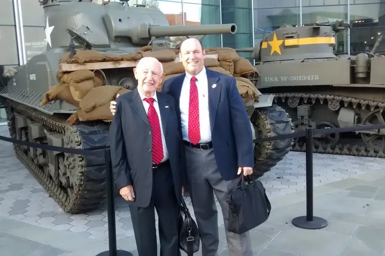 Douglas Cervi , the new executive director of the New Jersey Holocaust Commission on Education, (right) and David Wisnia, a Holocaust survivor, are pictured at a World War II museum in New Orleans where Wisnia was the keynote speaker at a conference.