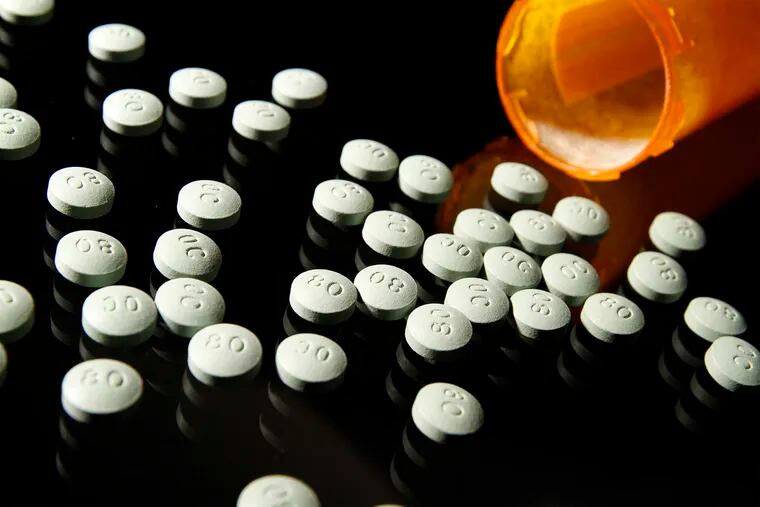 OxyContin, in 80 mg pills, in a 2013 file image. Doctors who receive gifts and payments from opioid manufacturers are more likely to prescribe higher amounts of opioid painkillers than their colleagues, according to researchers.