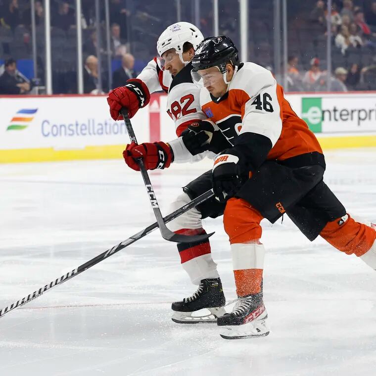 Flyers right wing Bobby Brink goes after the puck against Devils defenseman Santeria Hatakka.