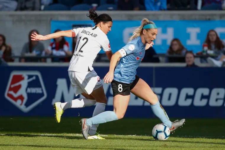 Chicago Red Stars midfielder Julie Ertz (8) and Portland Thorns forward Christine Sinclair (12) battling for the ball during a NWSL playoff game last year.