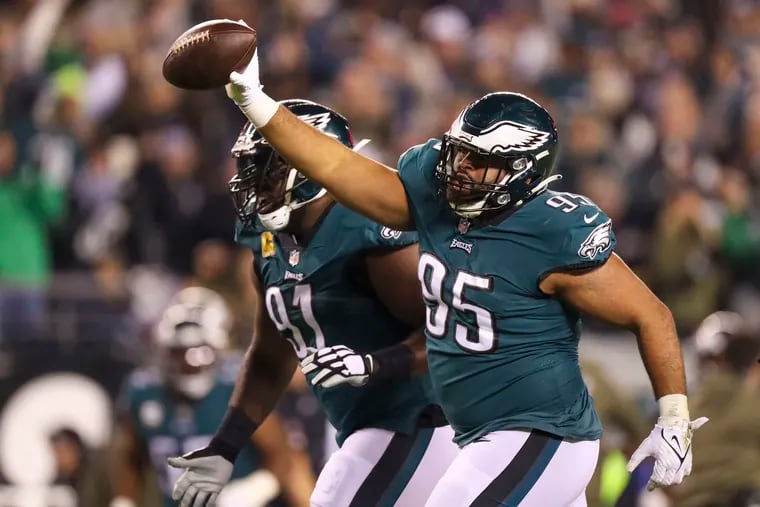 Philadelphia Eagles defensive tackle Marlon Tuipulotu celebrates fumble recovery in the first quarter as the Eagles play the Commanders at Lincoln Financial Field on Monday, Nov. 14, 2022, in Philadelphia.