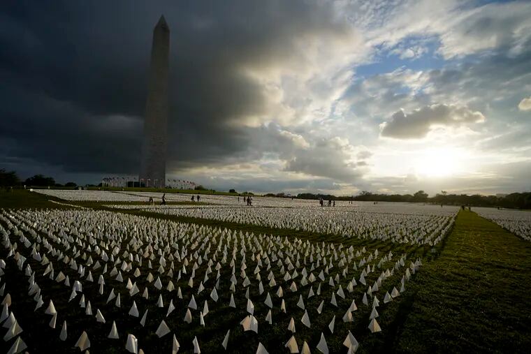 More than 630,000 white flags were displayed in honor of the Americans who died of COVID-19 on the National Mall in Washington on Sept. 17. (AP Photo/Brynn Anderson, File)