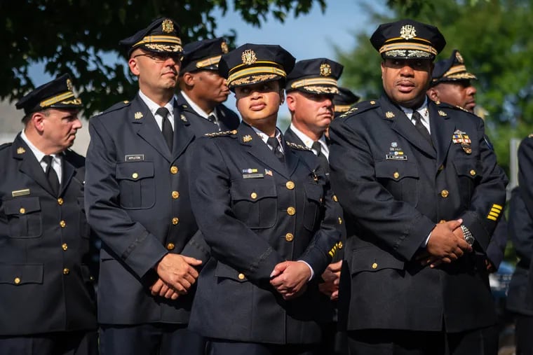 Commissioner Danielle Outlaw, front center, and Deputy Commissioner John Stanford, front right, along with other top department officials, before the viewing and funeral service for Philadelphia Police Officer Lynneice Hill at the Mount Airy Church of God in Christ on July 26.