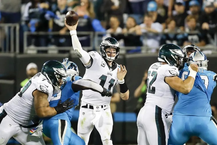Eagles quarterback Carson Wentz throws the football against the Carolina Panthers on Thursday, October 12, 2017 in Charlotte, NC. YONG KIM / Staff Photographer