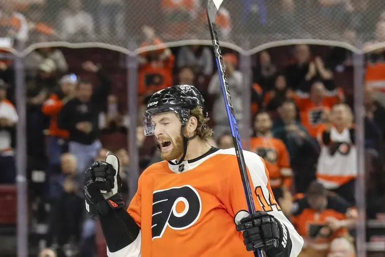 Flyers center Sean Couturier yells after scoring against the Arizona Coyotes on Monday.