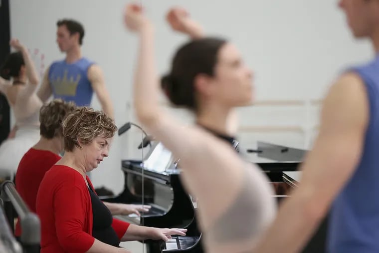 Pennsylvania Ballet principal pianist Martha Koeneman rehearses the ballet "Jewels" with dancers at their practice facility.