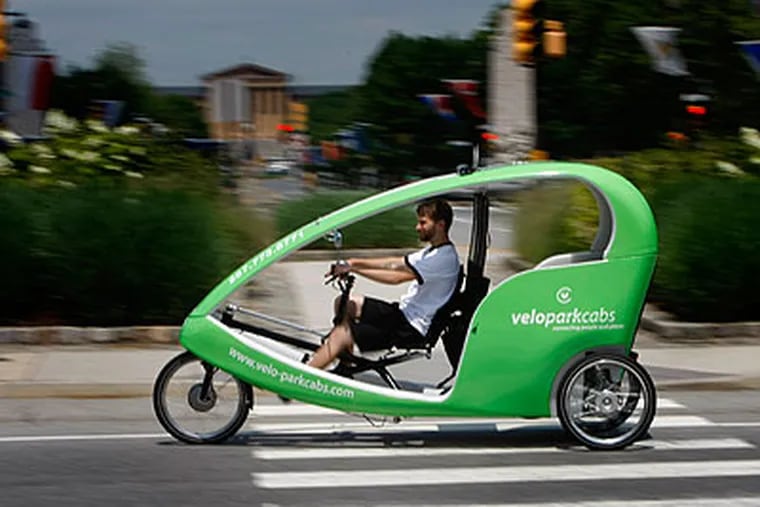 Sean Leahy, a driver for Veloparkcabs, pedals around Logan Circle on his first day on the job. (Michael S. Wirtz / Staff Photographer)