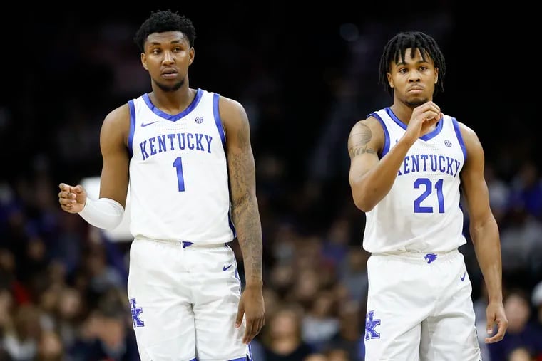 Kentucky guard Justin Edwards (left) with teammate guard D.J. Wagner during a break against Penn in the second half at the Wells Fargo Center in South Philadelphia on Saturday, December 9, 2023.