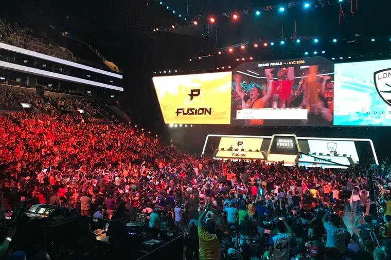 Fans of the e-sports Overwatch League watch as the Philadelphia Fusion competed against the London Spitfire in the Overwatch League Grand Finals at the Barclays Center in New York City, N.Y. on Saturday, July 28, 2018. (Courtney Becker/Philadelphia Inquirer/TNS)