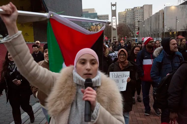 Temple students, alumni, and others, led by the president of the Students for Justice for Palestine, march at Temple University in 2018 in support of Marc Lamont Hill, who was then a professor there facing backlash for using the phrase "a free Palestine from the river to the sea."