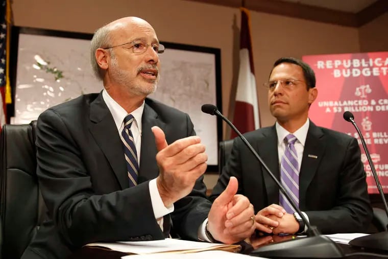 In this file photo, Gov. Tom Wolf (left) and then-Montgomery County Commissioners Chairman Josh Shapiro talk about the state's finances in Norristown. Shapiro is now the attorney general of Pennsylvania, and the pair on Thursday announced new protections for renters and homeowners experiencing financial hardship as a result of the pandemic.