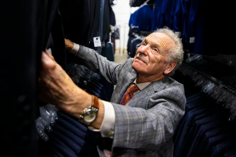 Richard Seitchik, 82, third-generation owner of W. Seitchik & Sons, Inc. checks the suits in the company's warehouse in Northeast Philadelphia.