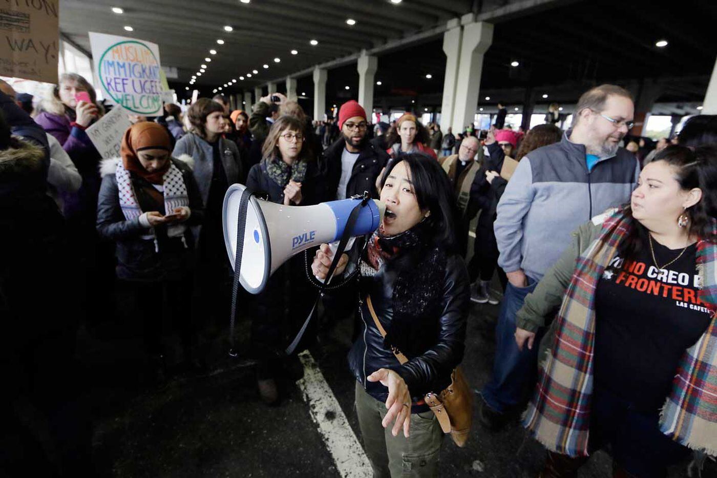 Councilwoman Helen Gym speaks at a protest at Philadelphia International Airport in January 2017.