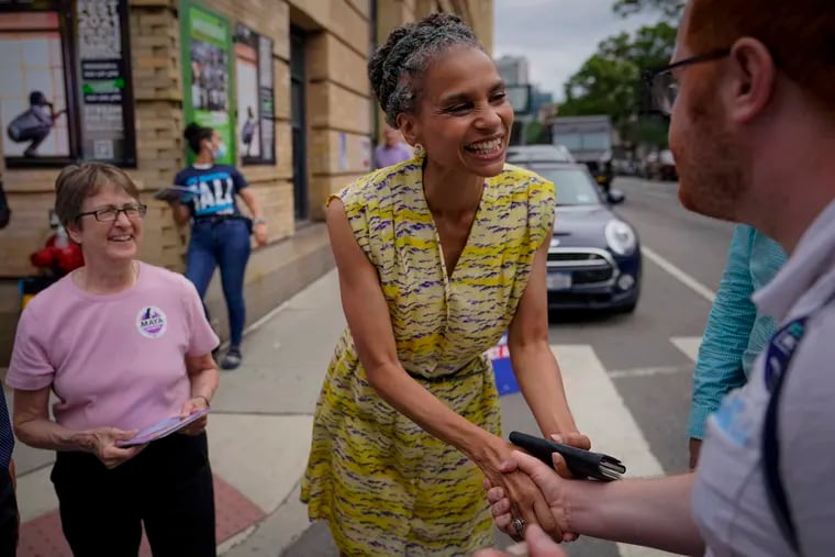 In this Tuesday June 22, 2021, file photo, Democratic mayoral candidate Maya Wiley (center) greets voters during a campaign stop in the West Village neighborhood of New York. Eric Adams holds a lead in New York City's Democratic mayoral primary, but with hundreds of thousands of votes set to be redistributed in a new ranked choice voting system, it remained possible for opponents Wiley or Kathryn Garcia to come out on top.