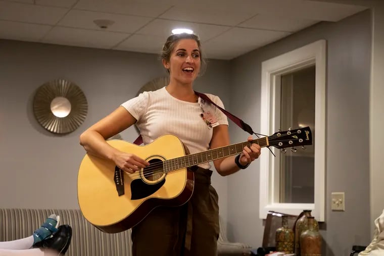 Music therapist Molly Bybee, 29, sings for her class of residents at the Paul's Run Halle Health Center.  Bybee uses techniques from a branch of music therapy called neurologic music therapy to reinforce her verbal commands. "Music has always been a part of my life," Bybee said.