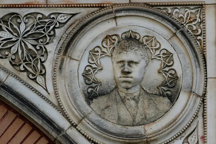 A frieze of James Ralston Amos above the arch entrance to Amos Hall at Lincoln University. (MICHAEL S. WIRTZ/Staff Photographer)