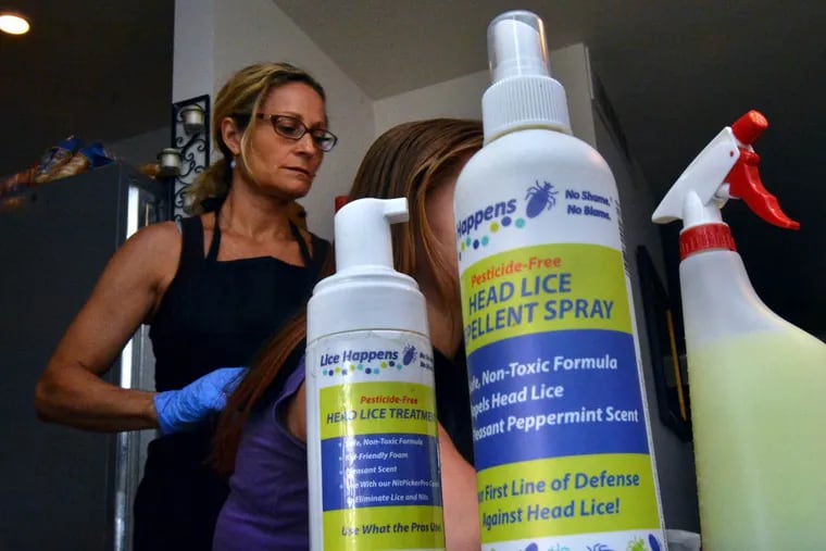 Emily Clark, a technician with Lice Happens, performs a removal at a home in Northeast Philadelphia.