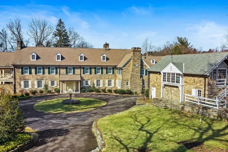 The property includes a renovated barn, which houses a two-car garage on the first floor and a mirrored dance studio on the second.