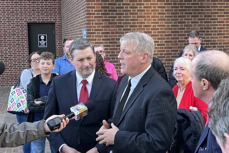 Anti-abortion activist Mark Houck (right) and attorney Peter C. Breen (left) speak to reporters outside the federal courthouse in Center City, after Houck was acquitted last January of charges tied to a 2021 altercation between him and a patient escort volunteer outside of the Planned Parenthood clinic near 12th and Locust Streets. Houck is now a candidate for Congress.