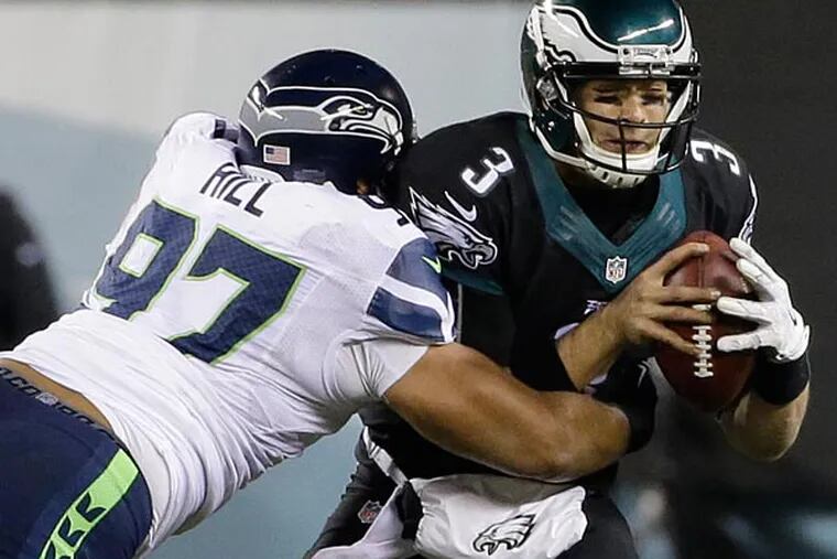 Philadelphia Eagles' Mark Sanchez is sacked during the second half of
an NFL football game against the Seattle Seahawks, Sunday, Dec. 7,
2014, in Philadelphia. (Michael Perez/AP)