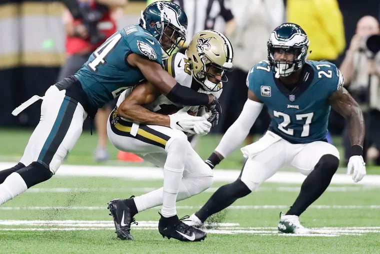Eagles free safety Corey Graham and strong safety Malcolm Jenkins go after New Orleans Saints wide receiver Tre'Quan Smith on Sunday, November 18, 2018 in New Orleans.  YONG KIM / Staff Photographer