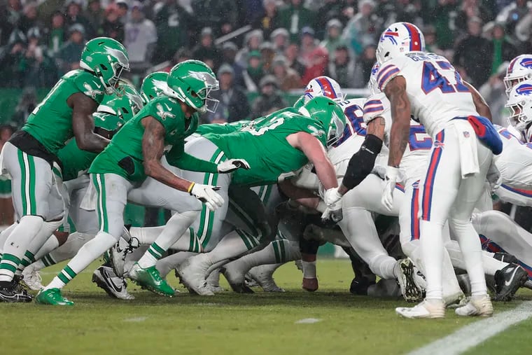 Eagles offensive tackle Jack Driscoll (center) blocks Bills defenders during a Brotherly Love touchdown against Buffalo.