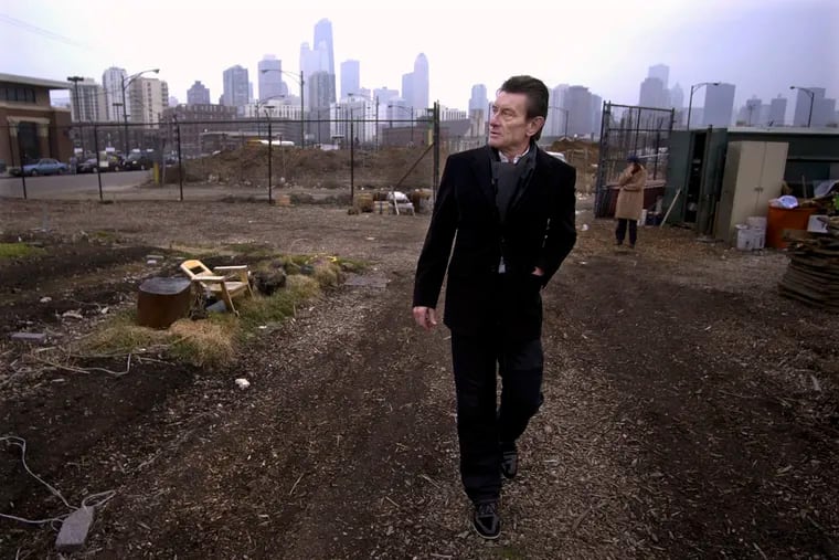 In this March 4, 2004 file photo, architect Helmut Jahn walks through a vacant lot on Chicago's Near North side. Jahn, who designed One Liberty Place in Philadelphia, was killed when two vehicles struck the bicycle he was riding outside Chicago on Saturday.