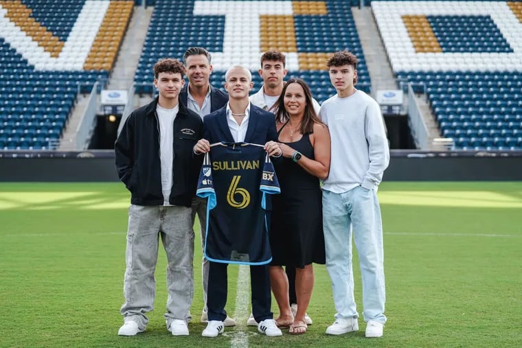 Cavan Sullivan (center) has signed with the Union. From left is his family: Declan, father Brendan, Cavan, Quinn, mother Heike, and Ronan.