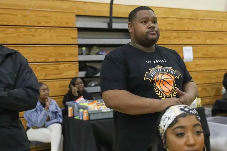 Saleem Jones, brother of Juawann Mason, watches a game at the first “Ball for Whomp” basketball tournament at the Audenried Junior High School gym this week. Mason, who was nicknamed Whomp, was a former high school basketball star and Bloomsburg University graduate who was shot and killed in 2020.