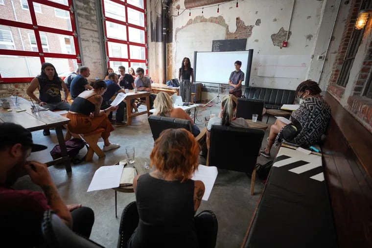 A training session at Love City Brewing led by LaQuisha Anthony, trainer with WOAR, left, and Quinn Pellerito, right, a trainer with WOAR, Women Organized Against Rape, shown here during a Safe Bars initiative training session, a program that trains bar workers to recognize harassment. in Philadelphia, July 29, 2019. .