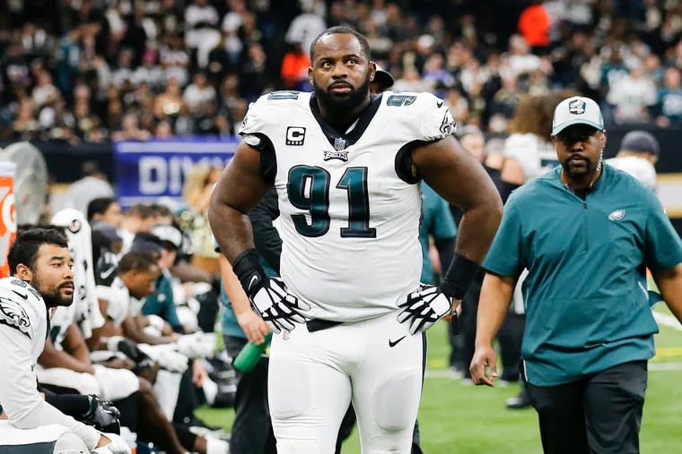 Fletcher Cox on the Eagles sideline after getting injured against the New Orleans Saints during the teams' January playoff game.