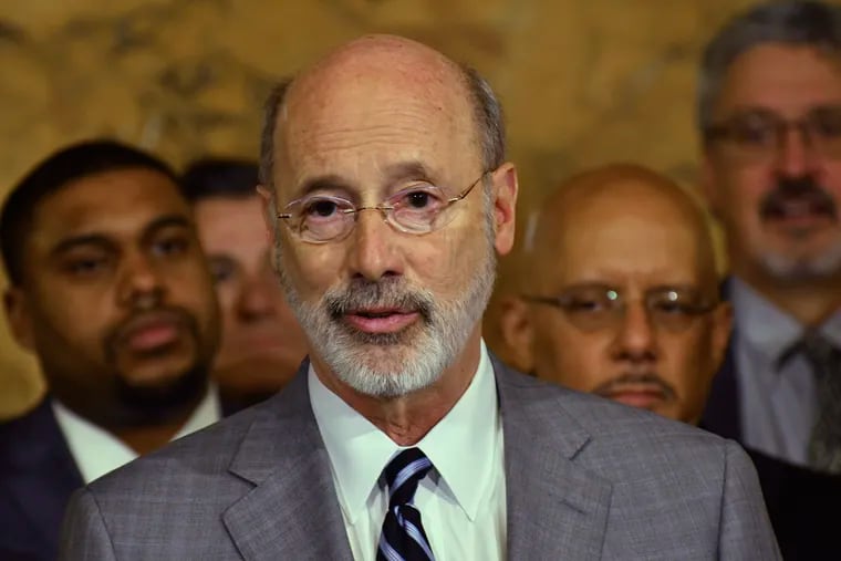 Gov. Tom Wolf speaks at a news conference in his Capitol offices as he unveils a $1.1 billion package intended to help eliminate lead and asbestos contamination in Pennsylvania's schools, homes, day care facilities and public water systems, Wednesday, Jan. 29, 2020 in Harrisburg, Pa. Looking on are Democratic state lawmakers and officials from teachers' unions. (AP Photo/Marc Levy)