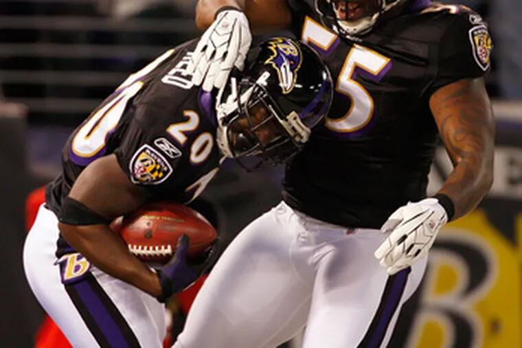 The Ravens&#0039; Ed Reed and Terrell Suggs (55) celebrate after Reed scored a touchdown against the Redskins last Sunday.