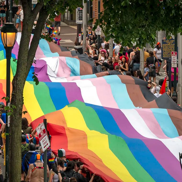 A 400-foot-long rainbow flag - the largest in Philadelphia history - moves along Walnut Street as Pride March and Festival kicks off with a march from Washington Square Sunday, June 2, 2024, with the theme, “Be You.”