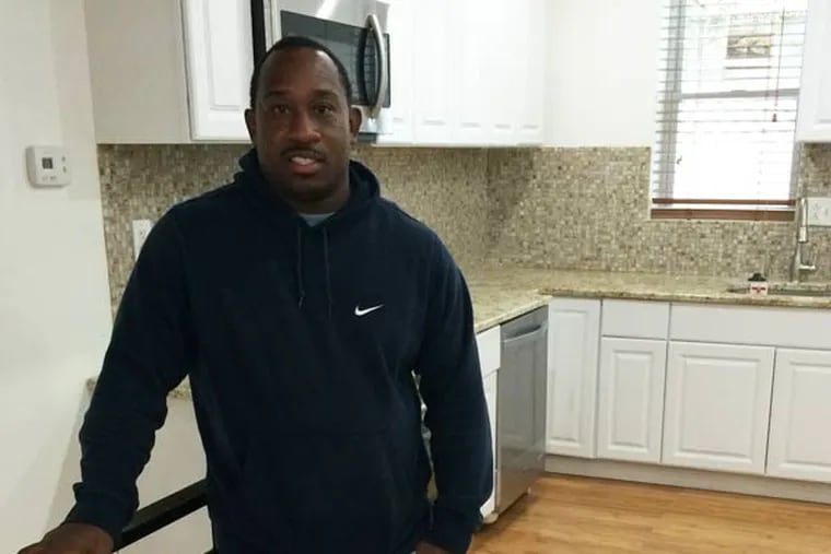 Greg Parker stands in the kitchen of his latest rehab, located at 3025 Redner Street in the Brewerytown neighborhood in North Philly.