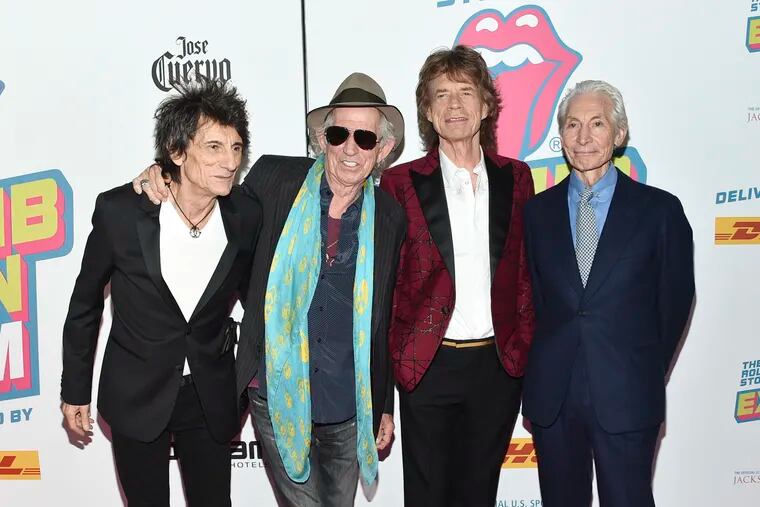 In this Nov. 15, 2016, file photo, the Rolling Stones -- from left, Ronnie Wood, Keith Richards, Mick Jagger, and Charlie Watts -- attend the opening night party for "Exhibitionism" at Industria in New York. The New Orleans Jazz and Heritage Festival has got satisfaction: The Rolling Stones are among headliners for the 50th anniversary festival. Organizers Tuesday, Jan. 15, 2019, confirmed reports that Mick Jagger and his band will play.  (Photo by Evan Agostini/Invision/AP, File)