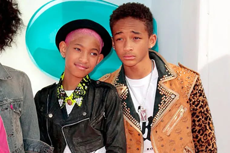 From left, Jada Pinkett Smith, Willow Smith and Jaden Smith arrive at Nickelodeon's 25th Annual Kids' Choice Awards on Saturday, March 31, 2012 in Los Angeles. (AP Photo/Jason Redmond)