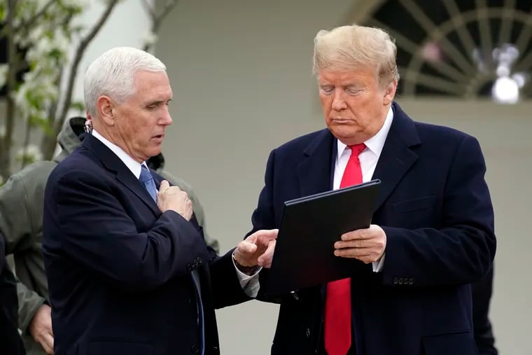 President Donald Trump speaks with Vice President Mike Pence as they arrive for a Fox News Channel virtual town hall, at the White House on Tuesday.