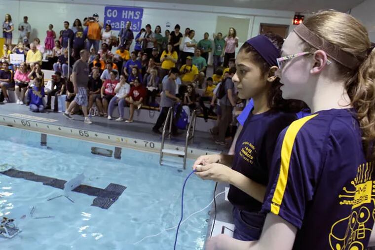 Claire Stridick and Ami Patel, members of team Angle Fish, compete in the SeaPerch underwater robot competition Saturday, April 18, 2015, at Rowan University in Glassboro. (Joseph Kaczmarek/For the Inquirer)
