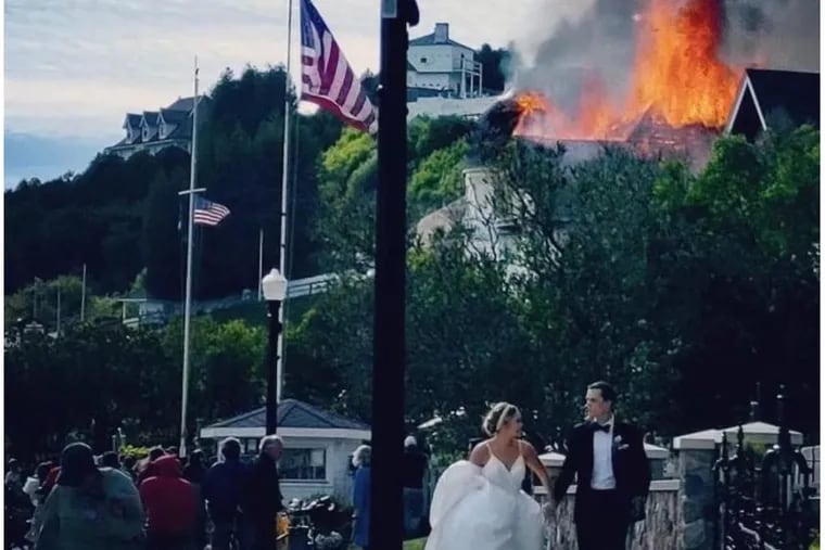 Jake and Elizabeth Landuyt on their wedding day, after a fire broke out at a private residence next door to the reception venue on Mackinac Island, Mich. The newlyweds and their guests were forced to evacuate the property.