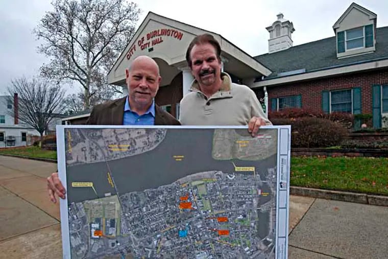 Redevelopment consultant Jim Kennedy, left, and Burlington City Mayor Jim Fazzone hold a map of the redevelopment area. (APRIL SAUL / Staff)