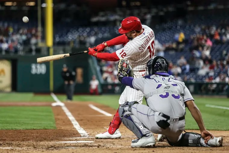 Phillies Kyle Schwarber hits a two run double against the Rockies during the 3rd inning at Citizens Bank Park in Philadelphia, Monday, April 25, 2022