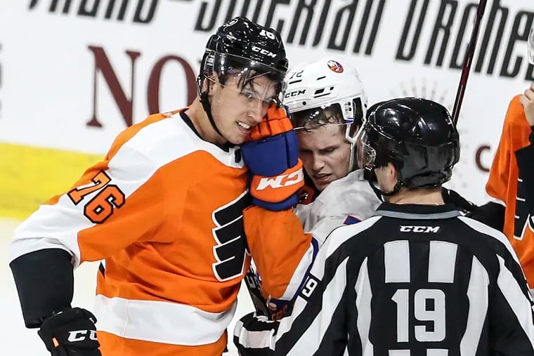The Flyers' Isaac Ratcliffe mixes it up with the Islanders' Justin Murray during the second period of Wednesday's rookie game at the PPL Center in Allentown.