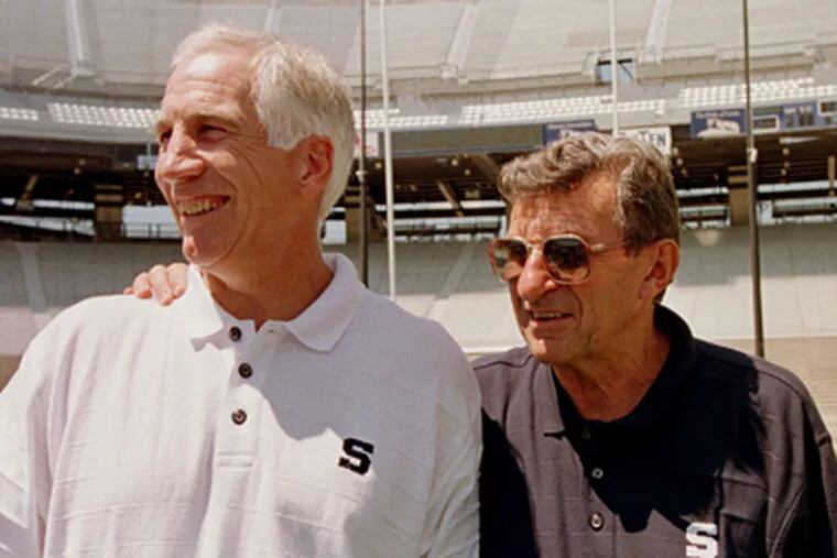 In this Aug. 6, 1999 file photo, Penn State head football coach Joe Paterno, right, poses with his defensive coordinator Jerry Sandusky during Penn State Media Day at State College, Pa. (AP File Photo)