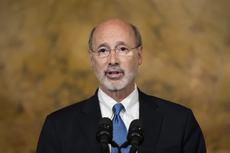 Gov. Tom Wolf speaks with members of the media during a news conference last month in Harrisburg.