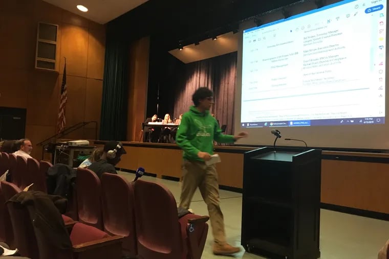 A resident walks to the microphone Monday, April 15, at a public meeting at Abington Senior High School, where many urged state officials to work faster to regulate PFAS chemicals in drinking water.