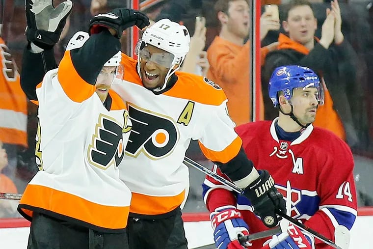 Claude Giroux celebrates his goal with teammate Wayne Simmonds against Montreal Canadiens.