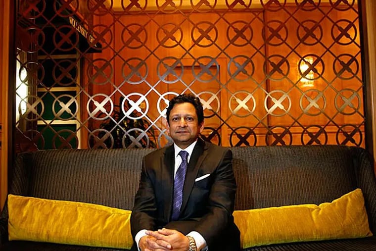 Jay H. Shah, CEO of Hersha Hospitality Trust, grew up in a motel his family owned outside Lancaster and now oversees an empire that includes the Rittenhouse, where he relaxed in the lobby. YONG KIM / Staff Photographer