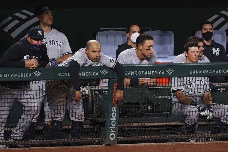 The New York Yankees dugout looks on dejected against the Baltimore Orioles during the ninth inning at Oriole Park at Camden Yards on April 26, 2021 in Baltimore, Maryland. (Photo by Patrick Smith/Getty Images)